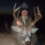 Young hunter with whitetail buck