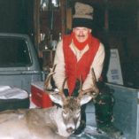 Whitetail buck in bed of hunter's truck